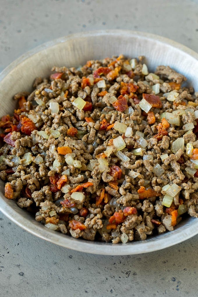 Cheeseburger Pie Recipe | Cheeseburger Casserole | Ground Beef Recipe #cheeseburger #beef #bacon #cheese #casserole #dinner #bajap Ground beef, onions and bacon in a tin.