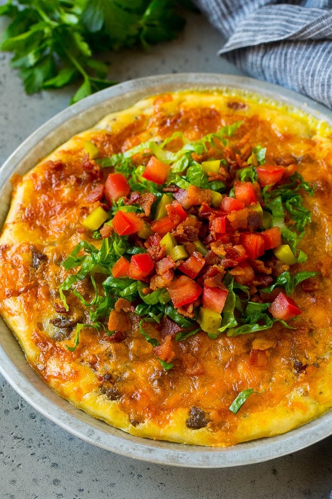 Cheeseburger Pie Recipe | Cheeseburger Casserole | Ground Beef Recipe #cheeseburger #beef #bacon #cheese #casserole #dinner #bajap Cheeseburger pie topped with bacon, lettuce, pickles and tomatoes.