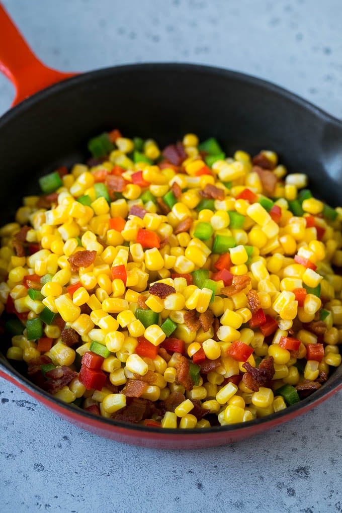 Corn Dip Recipe | Hot Cheese Dip | Bacon Dip #corn #dip #bacon #cheese #appetizer #snack #bajap Corn, bacon and bell peppers in a skillet.