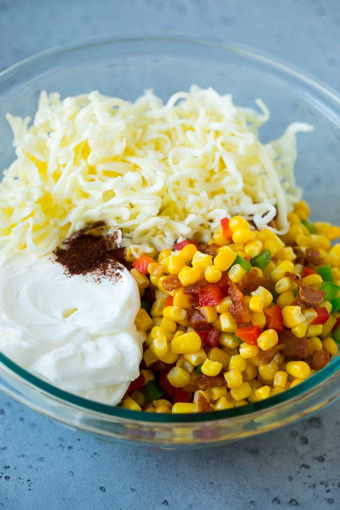 Corn Dip Recipe | Hot Cheese Dip | Bacon Dip #corn #dip #bacon #cheese #appetizer #snack #bajap Corn, bacon, bell peppers, sour cream and cheese in a mixing bowl.