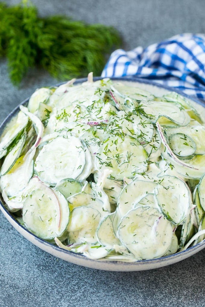 Creamy Cucumber Salad Recipe | German Cucumber Salad | Cucumber Salad #cucumber #salad #dinner #lunch #bajap #cucumbersalad A serving bowl of creamy cucumber salad topped with fresh dill.