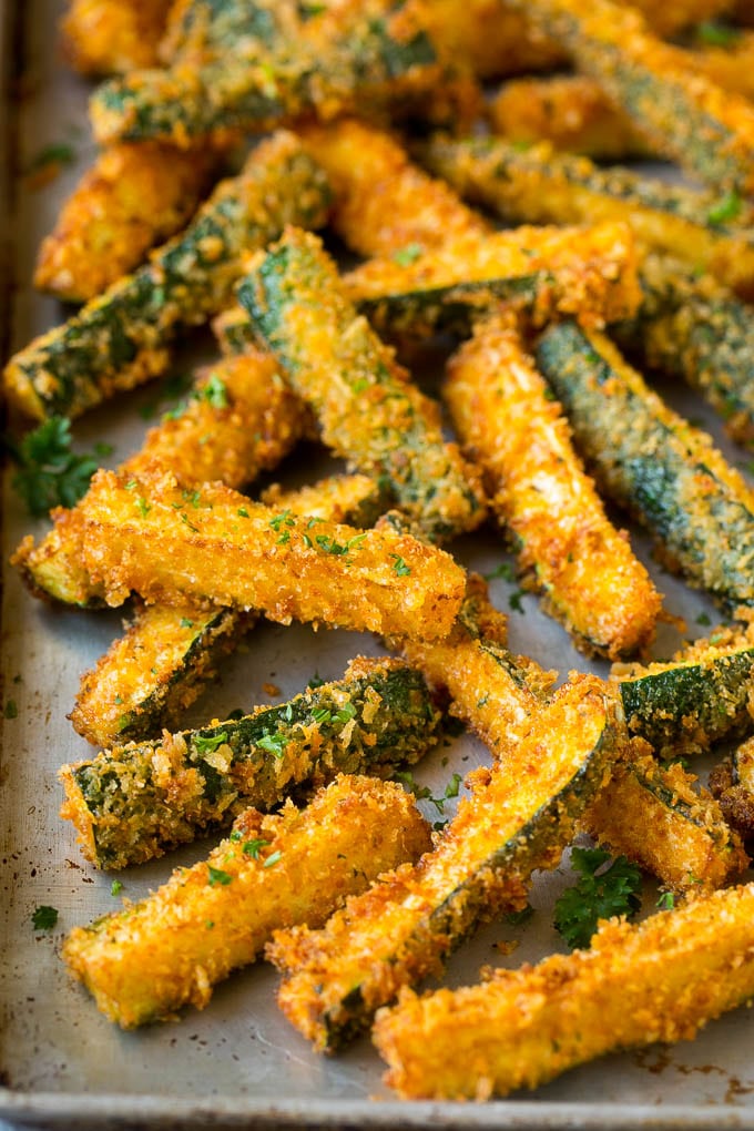 Fried Zucchini Recipe | Zucchini Fries | Zucchini Recipe #appetizer #zucchini #snack #bajap Fried zucchini sticks on a sheet pan.