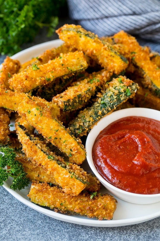 Fried Zucchini Recipe | Zucchini Fries | Zucchini Recipe #appetizer #zucchini #snack #bajap A plate of fried zucchini served with marinara for dipping.