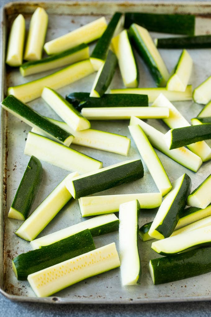 Fried Zucchini Recipe | Zucchini Fries | Zucchini Recipe #appetizer #zucchini #snack #bajap Raw sticks on a sheet pan.
