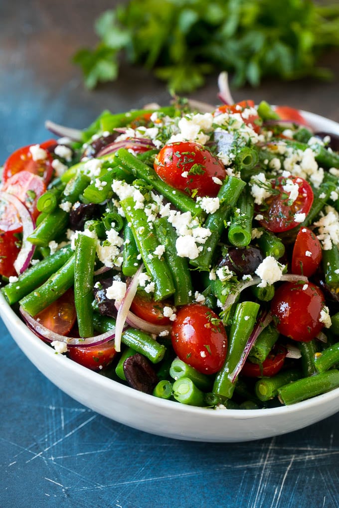 Green Bean Salad Recipe | String Bean Salad | Chopped Salad #greenbeans #tomatoes #olives #salad #cleaneating #lowcarb #glutenfree #bajap Green bean salad tossed in a vinaigrette and topped with feta cheese and herbs.