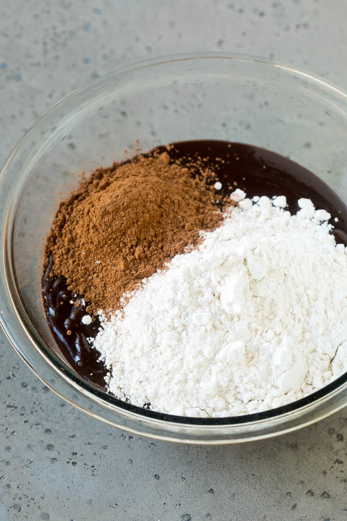 Oreo Brownies Recipe | Homemade Brownies | Chocolate Chip Brownies #brownies #oreos #chocolate #dessert #sweets #bajap Melted chocolate, sugar, cocoa powder and flour in a mixing bowl.