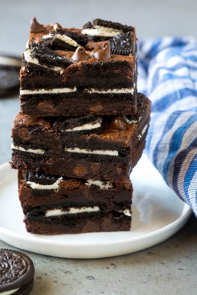 Oreo Brownies Recipe | Homemade Brownies | Chocolate Chip Brownies #brownies #oreos #chocolate #dessert #sweets #bajap A stack of Oreo brownies filled with sandwich cookies and chocolate chips.