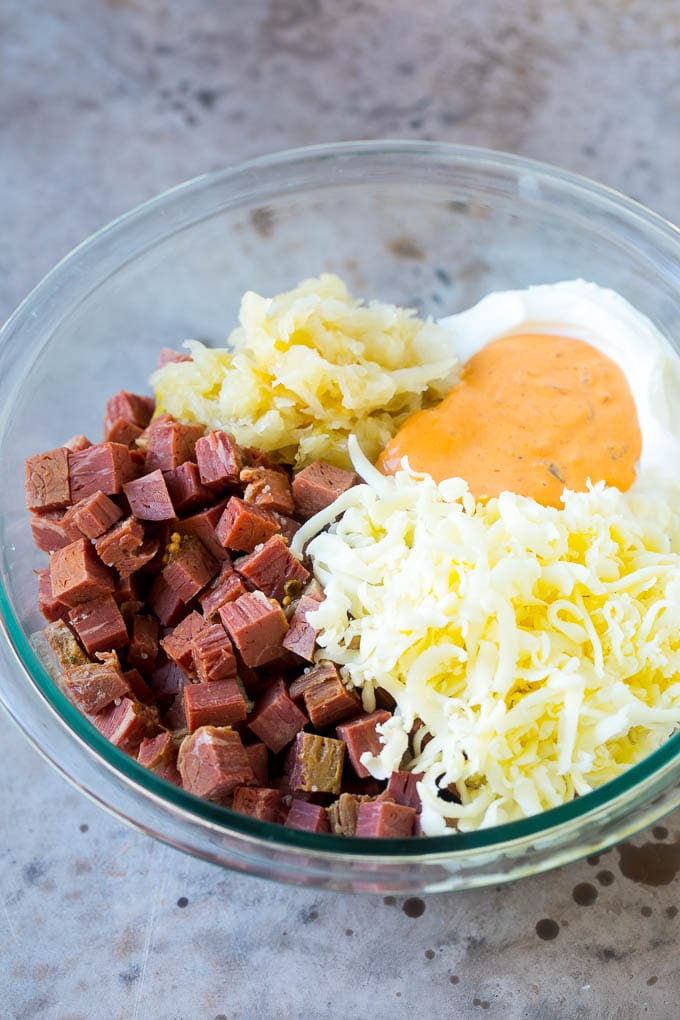 Reuben Dip Recipe | Corned Beef Dip | Cheese Dip #dip #cheese #cornedbeef #appetizer #lowcarb #keto #bajap Corned beef, cream cheese, Thousand Island dressing and cheese in a bowl.