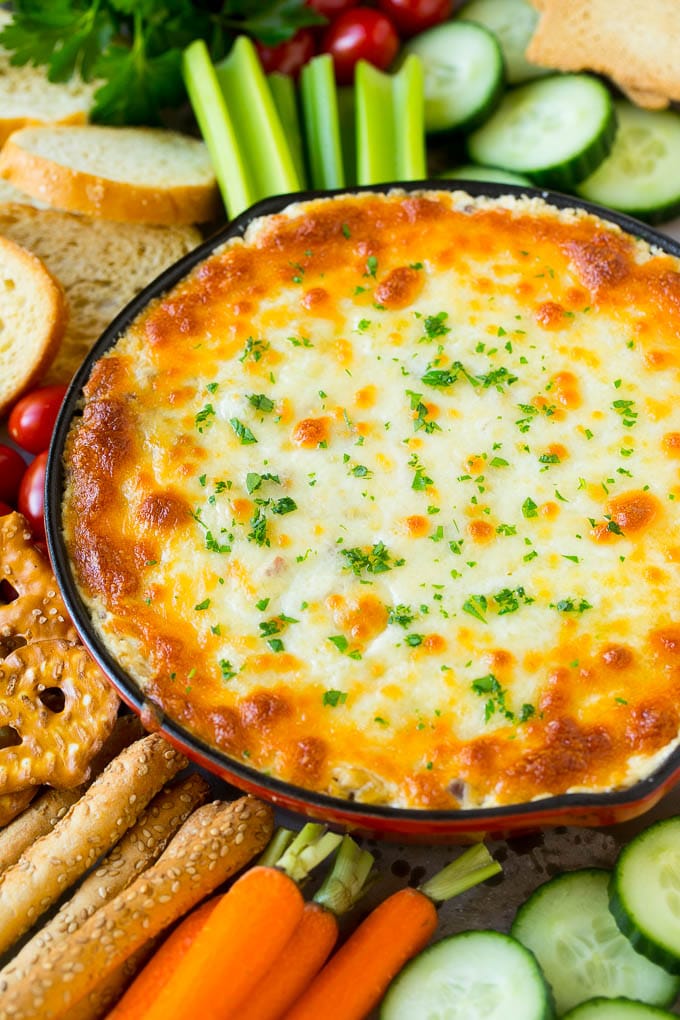 Reuben Dip Recipe | Corned Beef Dip | Cheese Dip #dip #cheese #cornedbeef #appetizer #lowcarb #keto #bajap Baked Reuben dip in a skillet served with crackers and vegetables.