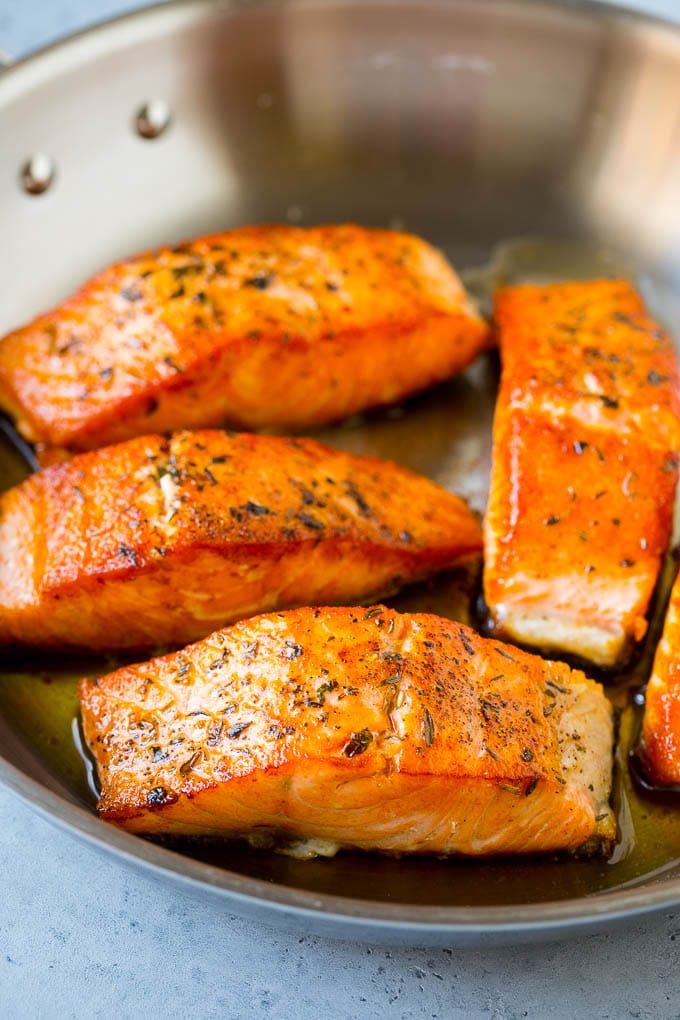 Greek Salmon Salad Recipe | Low Carb Salmon Recipe | Salmon Salad #salmon #seafood #fish #lowcarb #keto #lunch #bajap #healthy Seared fish fillets in a skillet.
