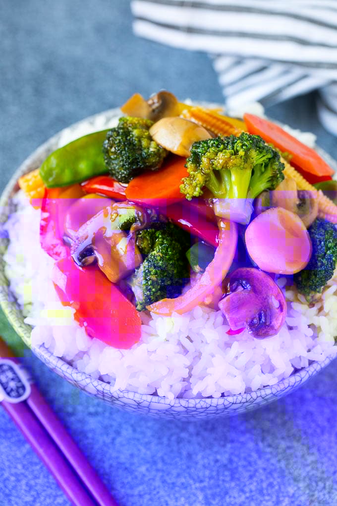 Vegetable Stir Fry Recipe | Veggie Stir Fry | Broccoli Stir Fry #vegetarian #vegetables #broccoli #dinner #bajap Vegetable stir fry served over rice in a bowl.