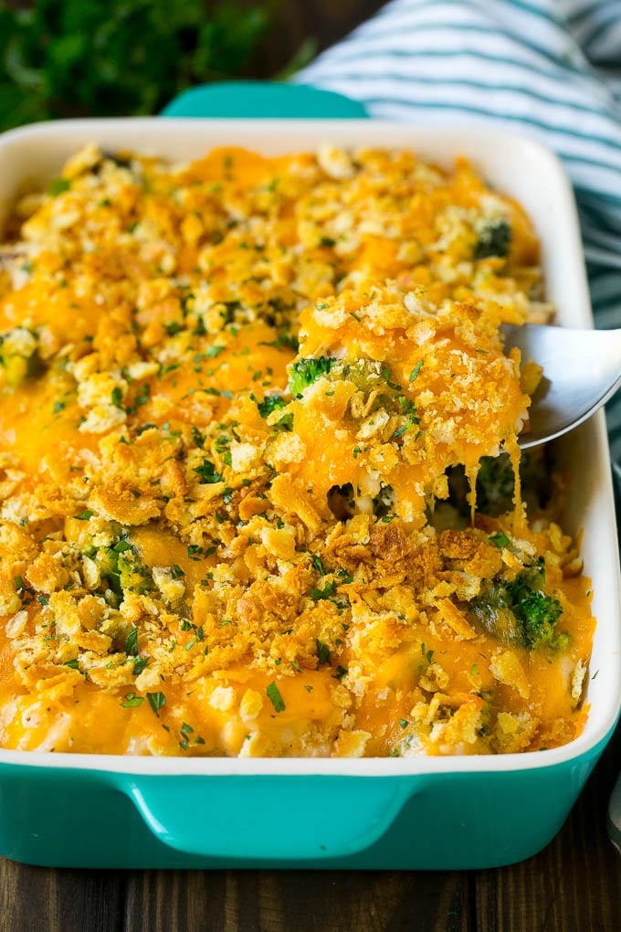 Chicken Casserole Recipe | Chicken and Rice Casserole | Chicken and Broccoli Casserole #casserole #chicken #rice #broccoli #cheese #dinner #bajap A spoon serving up a portion of chicken casserole made with rice and broccoli.