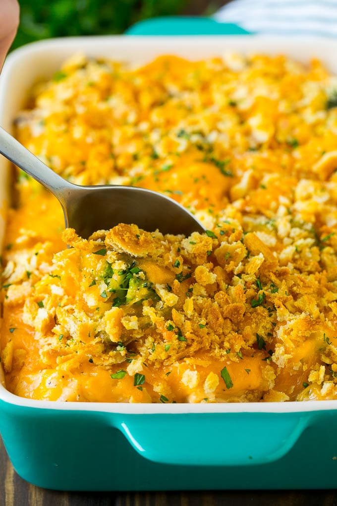 Chicken Casserole Recipe | Chicken and Rice Casserole | Chicken and Broccoli Casserole #casserole #chicken #rice #broccoli #cheese #dinner #bajap A spoon in a dish of chicken and rice casserole.