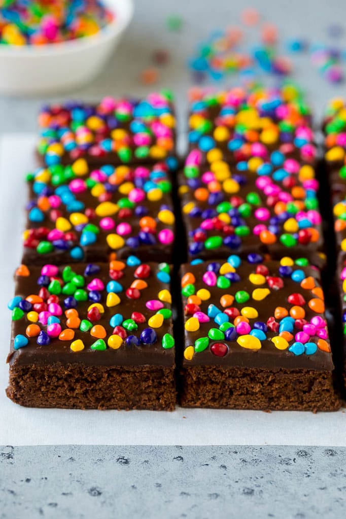 Cosmic Brownies Recipe | Cocoa Brownies | Frosted Brownies #brownies #chocolate #dessert #bajap #sprinkles Cosmic brownies topped with chocolate fudge and crunchy rainbow sprinkles.