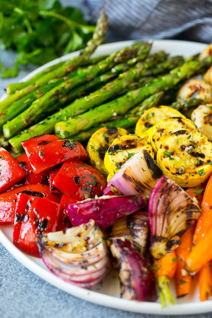Grilled Vegetables Recipe | Marinated Vegetables | Grilled Veggies #vegetables #veggies #grilling #glutenfree #lowcarb #keto #dinner #bajap #cleaneating #healthy A platter of grilled veggies including peppers, onions and carrots.