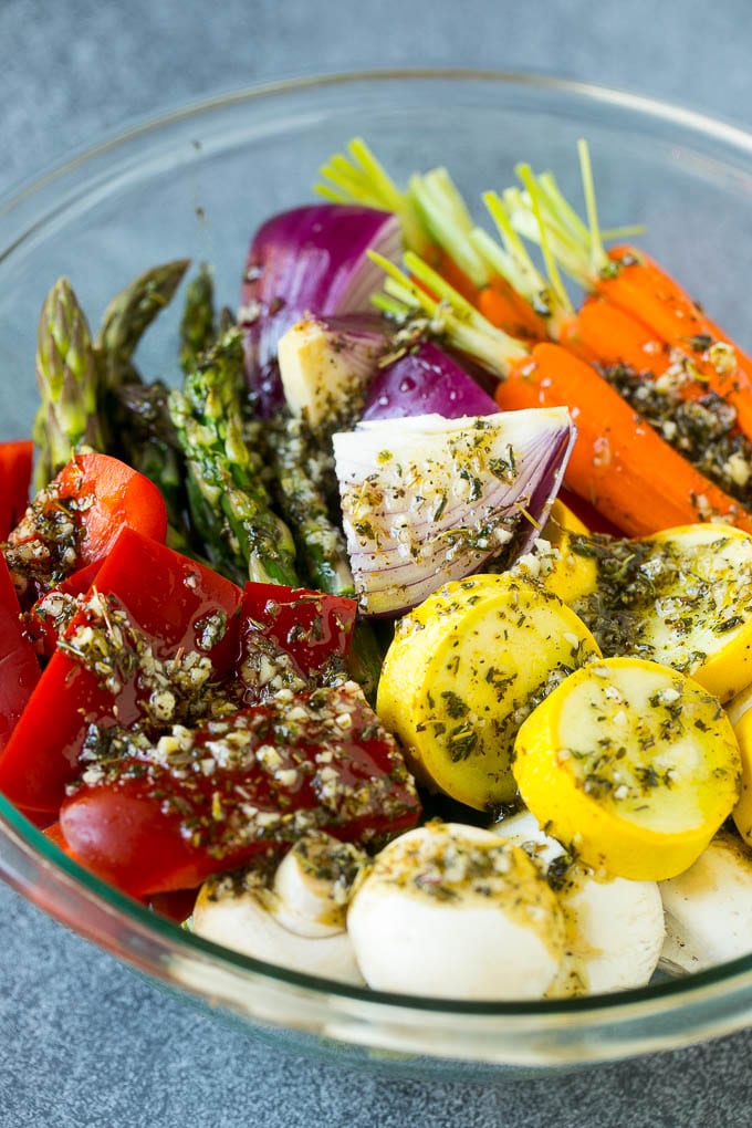 Grilled Vegetables Recipe | Marinated Vegetables | Grilled Veggies #vegetables #veggies #grilling #glutenfree #lowcarb #keto #dinner #bajap #cleaneating #healthy Raw veggies in a bowl with garlic, herbs and olive oil.