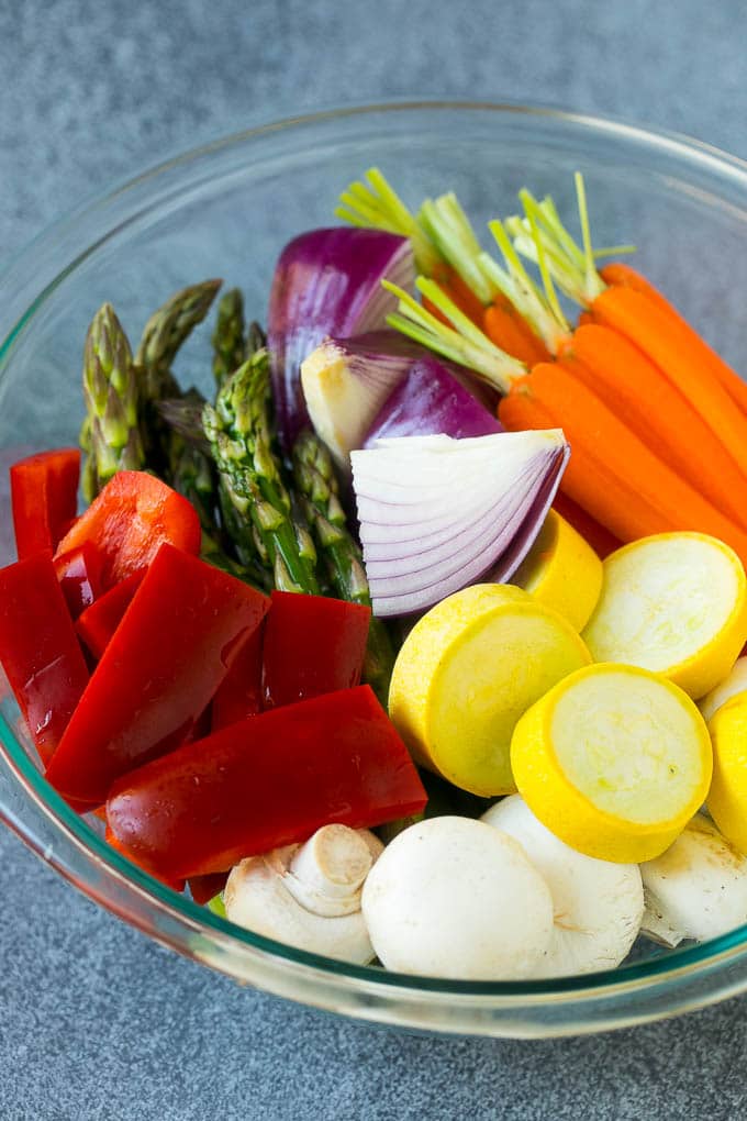 Grilled Vegetables Recipe | Marinated Vegetables | Grilled Veggies #vegetables #veggies #grilling #glutenfree #lowcarb #keto #dinner #bajap #cleaneating #healthy Carrots, peppers, squash, mushrooms and asparagus in a mixing bowl.