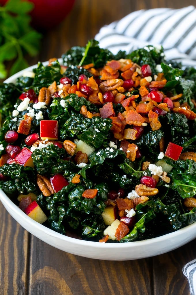 Apple Kale Salad Recipe | Kale Recipe | Fall Salad #kale #apples #bacon #salad #feta #dinner #lunch #bajap Apple kale salad topped with bacon and pecans.