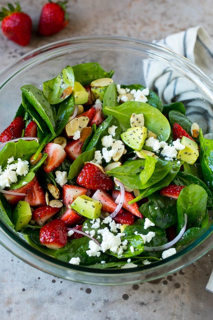 Strawberry Spinach Salad Recipe | Strawberry Salad | Spinach Salad #spinach #salad #strawberries #avocado #bajap A bowl of strawberry spinach salad with feta cheese, almonds and avocado.