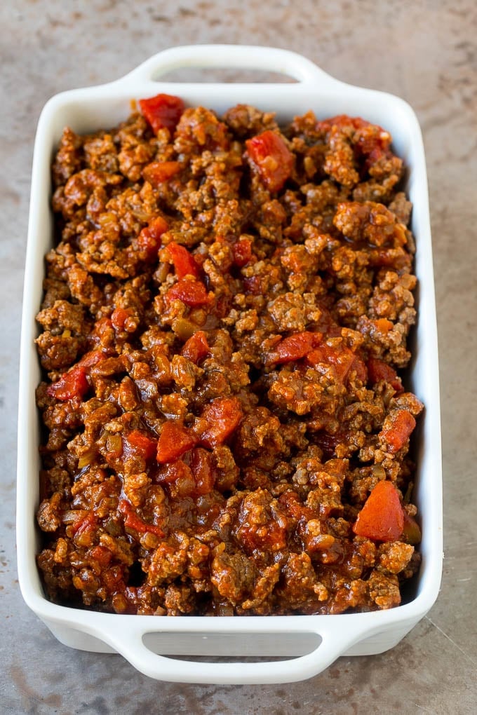 Taco Casserole Recipe | Mexican Casserole | Beef Casserole #casserole #tacos #beef #dinner #cheese #bajap Cooked taco meat in a casserole dish.