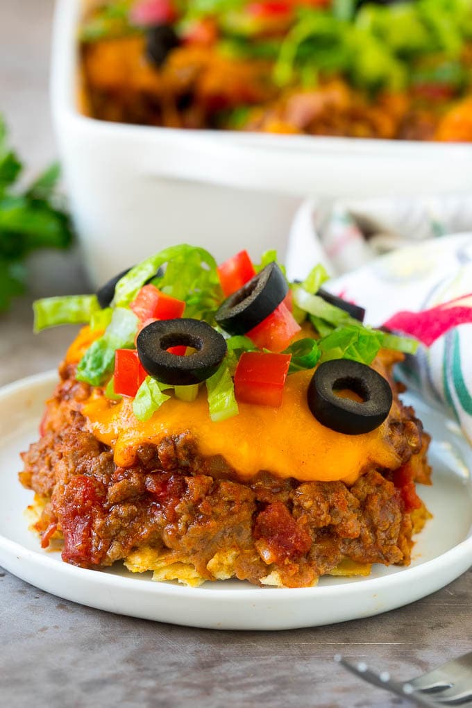 Taco Casserole Recipe | Mexican Casserole | Beef Casserole #casserole #tacos #beef #dinner #cheese #bajap A serving of taco casserole topped with melted cheese.