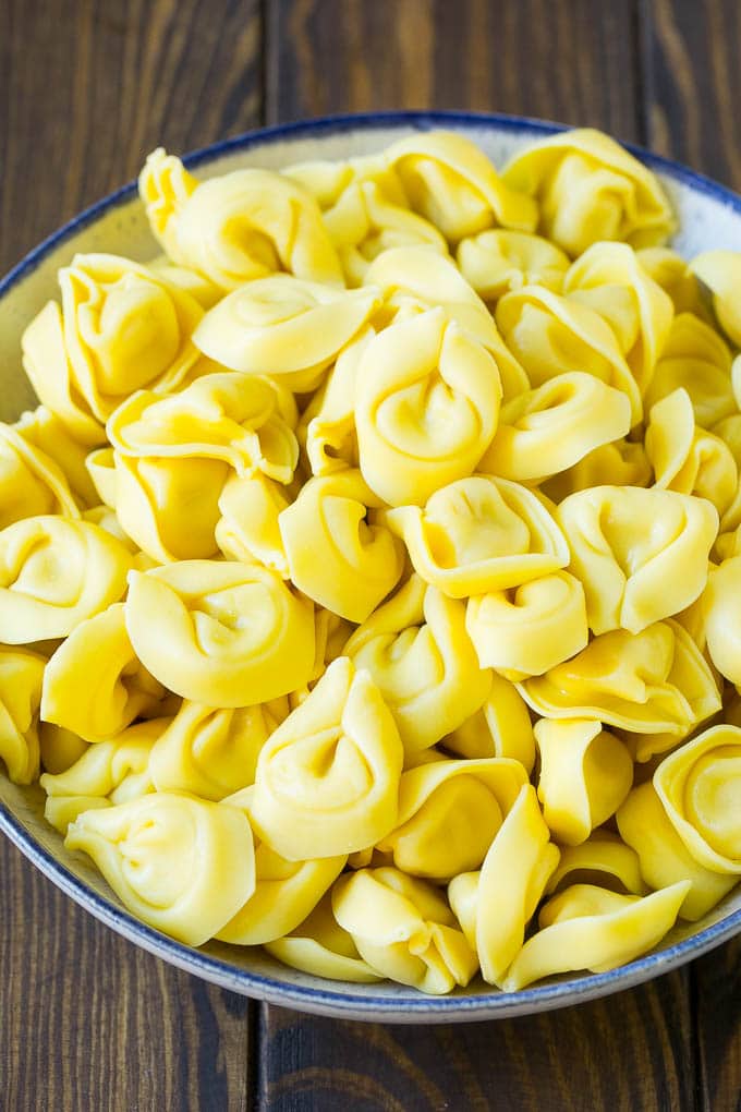 Greek Tortellini Salad Recipe | Pasta Salad | Tortellini Salad | Greek Salad #greek #tortellini #pasta #salad #cucumbers #olives #dinner #bajap A bowl of cooked cheese tortellini.