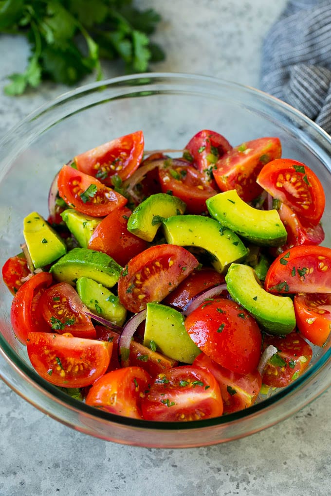 Tomato Avocado Salad Recipe | Avocado Salad | Tomato Salad #salad #tomato #avocado #glutenfree #cleaneating #dinner #bajap #healthy Tomato avocado salad with red onion and a cilantro lime dressing.