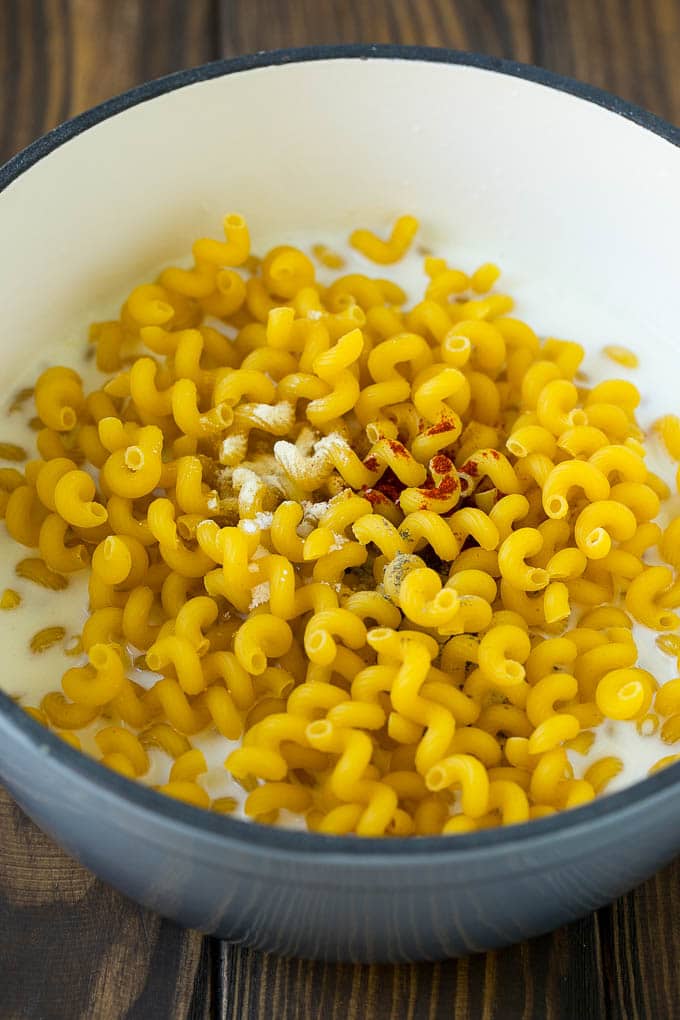 Lobster Mac and Cheese Recipe | Lobster Macaroni and Cheese | Baked Mac and Cheese #pasta #macandcheese #macaroni #lobster #cheese #dinner #bajap Pasta with milk and spices in a pot.
