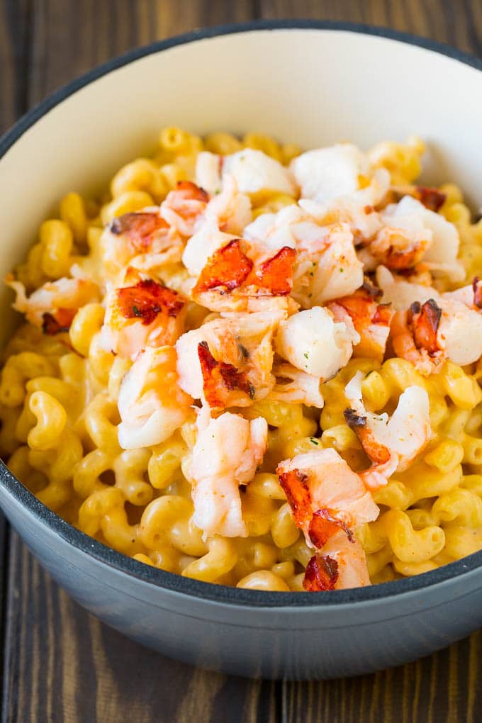 Lobster Mac and Cheese Recipe | Lobster Macaroni and Cheese | Baked Mac and Cheese #pasta #macandcheese #macaroni #lobster #cheese #dinner #bajap Stove top mac and cheese topped with pieces of cooked lobster.