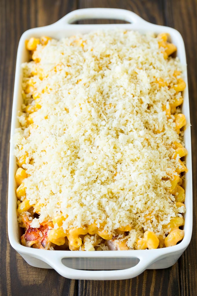 Lobster Mac and Cheese Recipe | Lobster Macaroni and Cheese | Baked Mac and Cheese #pasta #macandcheese #macaroni #lobster #cheese #dinner #bajap A casserole dish of lobster mac and cheese topped with panko breadcrumbs.