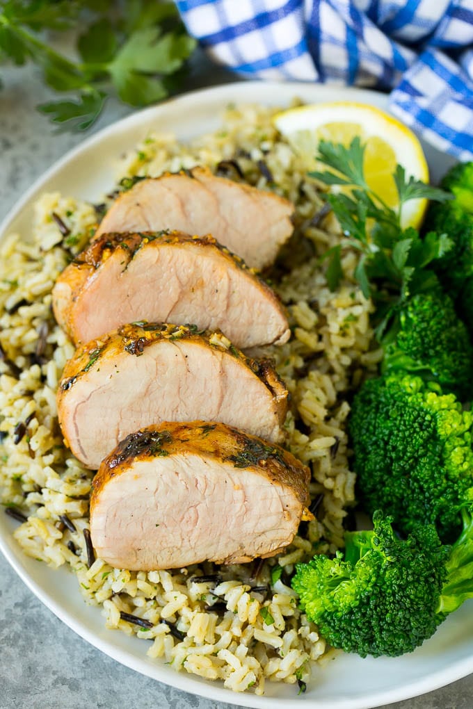 Marinated Pork Tenderloin Recipe | Pork Tenderloin Marinade | Pork Marinade #pork #porktenderloin #marinade #dinner #grilling #bajap Pork tenderloin marinade over sliced pork, served with rice and broccoli.