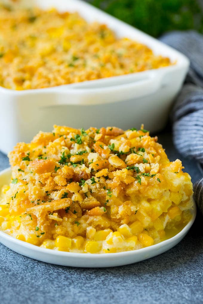 Scalloped Corn | Corn Casserole #corn #casserole #cheese #sidedish #dinner #bajap A serving of scalloped corn topped with buttery cracker crumbs.