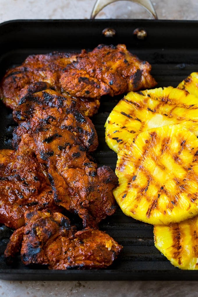 Tacos al Pastor Recipe | Pork Tacos | Mexican Tacos #tacos #pork #pineapple #grilling #tacotuesday #dinner #bajap Grilled pork and pineapple on a pan.