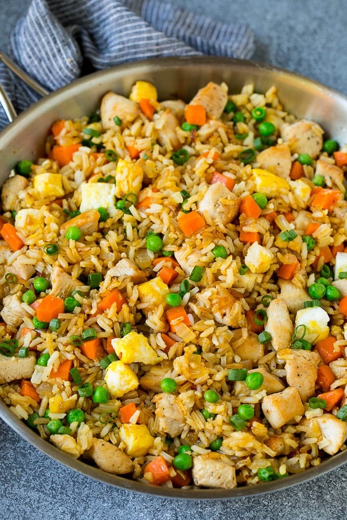 Chicken Fried Rice Recipe | Chinese Fried Rice #rice #chicken #peas #carrots #sidedish #dinner #bajap A pan of chicken fried rice with eggs and vegetables.