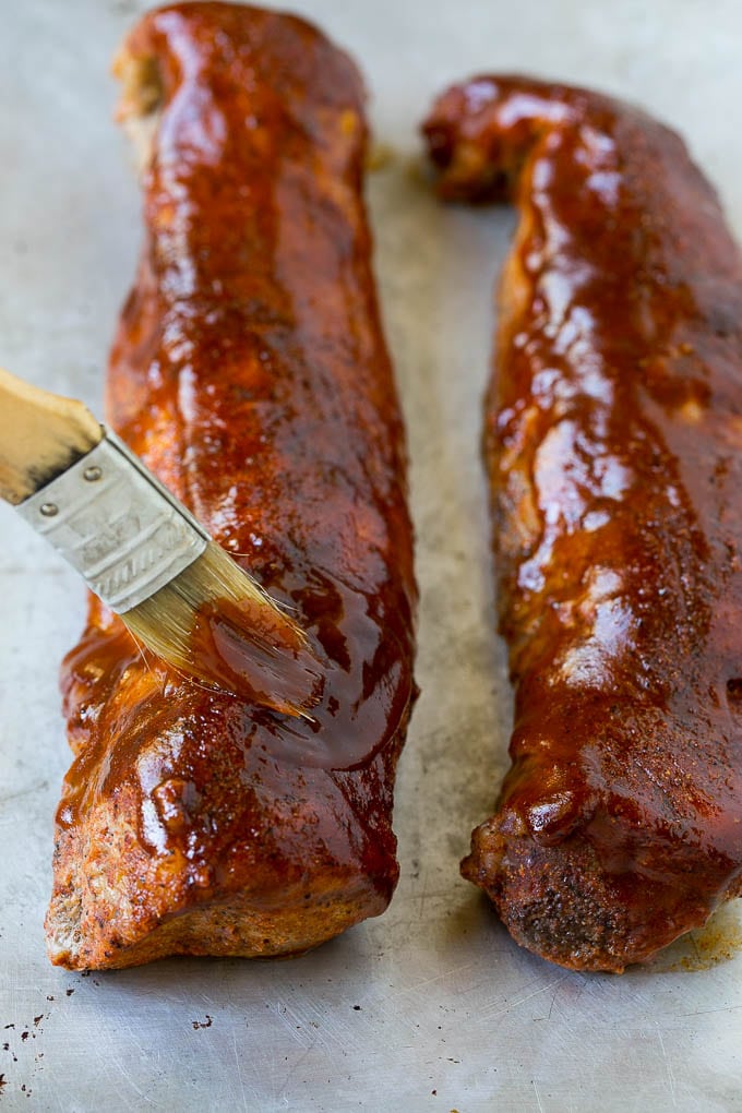 Smoked Pork Tenderloin Recipe | Smoked Pork Loin | BBQ Pork #pork #tenderloin #smoker #dinner #bajap BBQ sauce being brushed over smoked pork loin.