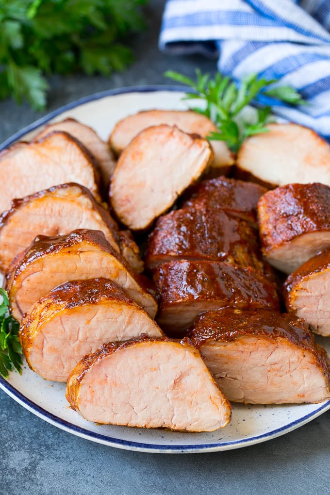 Smoked Pork Tenderloin Recipe | Smoked Pork Loin | BBQ Pork #pork #tenderloin #smoker #dinner #bajap Smoked pork tenderloin sliced on a serving plate.