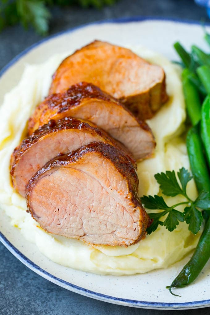 Smoked Pork Tenderloin Recipe | Smoked Pork Loin | BBQ Pork #pork #tenderloin #smoker #dinner #bajap Sliced smoked pork tenderloin served with mashed potatoes and vegetables.