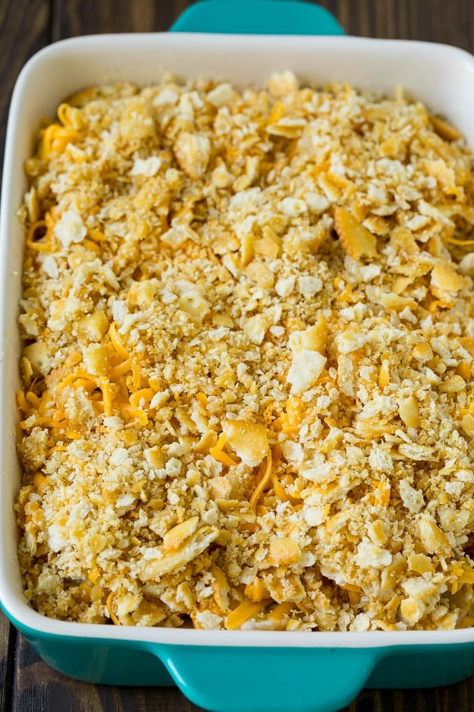 Squash Casserole Recipe | Vegetable Casserole | Zucchini Casserole #casserole #squash #zucchini #cheese #sidedish #bajap Squash in a baking dish topped with cracker crumbs and cheddar cheese.