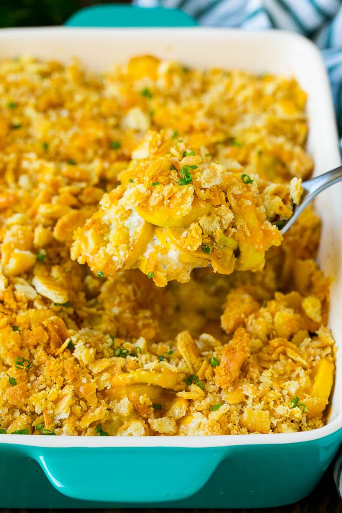 Squash Casserole Recipe | Vegetable Casserole | Zucchini Casserole #casserole #squash #zucchini #cheese #sidedish #bajap A spoon serving up a portion of cheesy squash casserole.