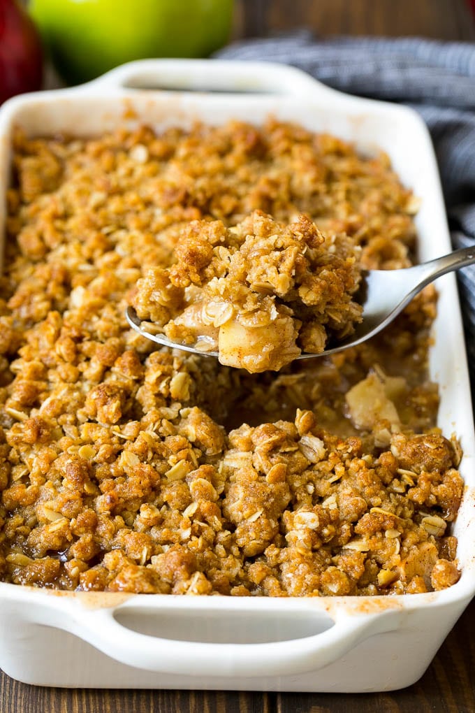 Apple Crisp Recipe | Apple Dessert #apples #dessert #baking #fall #bajap A spoon serving up a portion of apple crisp.