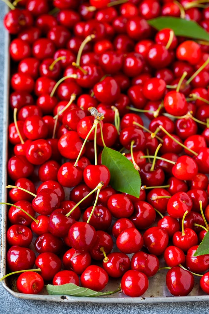 Cherry Pie Filling Recipe #pie #cherries #dessert #sweets #bajap #summer Fresh cherries spread out on a sheet pan.