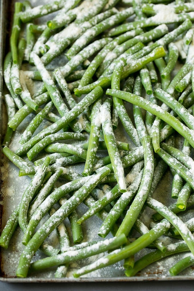 Fried Green Beans Recipe | Green Beans #greenbeans #appetizer #snack #bajap Bean coated in flour on a pan.