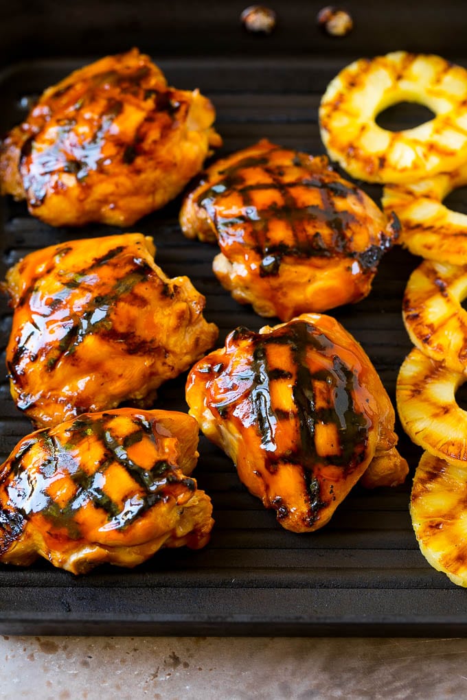 Huli Huli Chicken Recipe | Hawaiian Chicken | Grilled Chicken Thighs #chicken #pineapple #grilling #dinner #bajap Poultry and pineapple slices on a grill pan.
