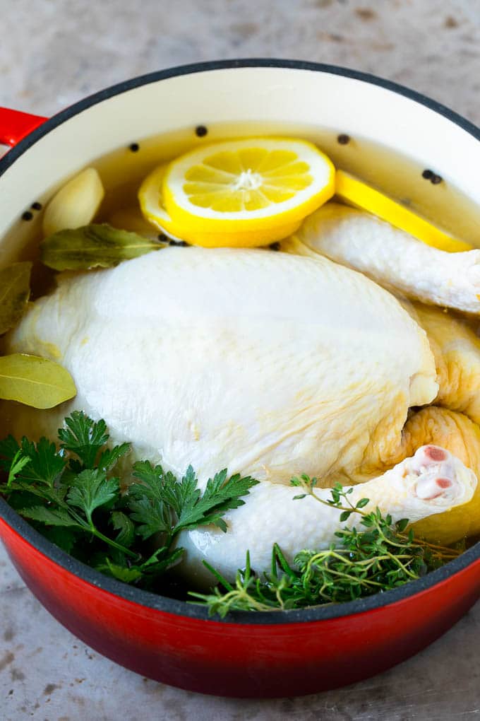 Rotisserie Chicken Recipe | Roasted Chicken #chicken #dinner #bajap #comfortfood A whole chicken in a pot of brine.