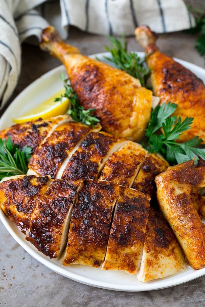 Rotisserie Chicken Recipe | Roasted Chicken #chicken #dinner #bajap #comfortfood Sliced roasted chicken on a serving plate.
