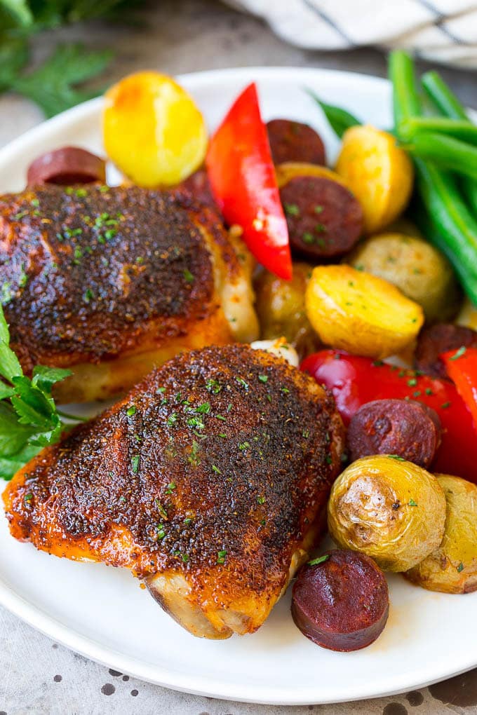 Spanish Chicken Recipe | Sheet Pan Meal | Chicken and Potatoes #spanishfood #chicken #sausage #potatoes #dinner #bajap A plate of Spanish chicken with potatoes, sausage and vegetables.