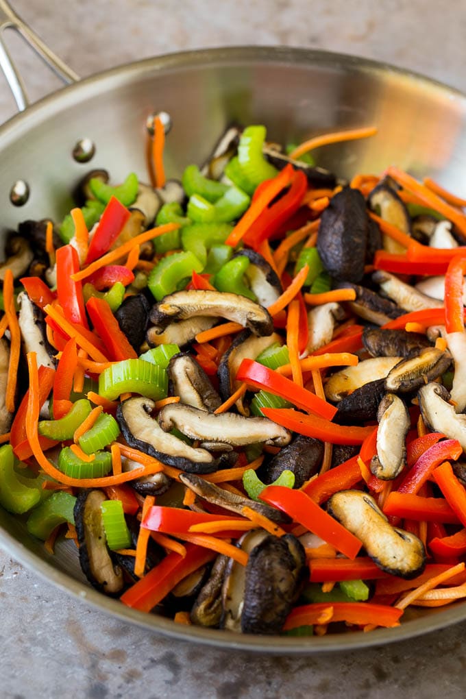 Stir Fry Noodles Recipe | Noodle Stir Fry #chicken #noodles #stirfry #mushrooms #dinner #bajap Mushrooms, bell pepper, celery and carrot in a pan.