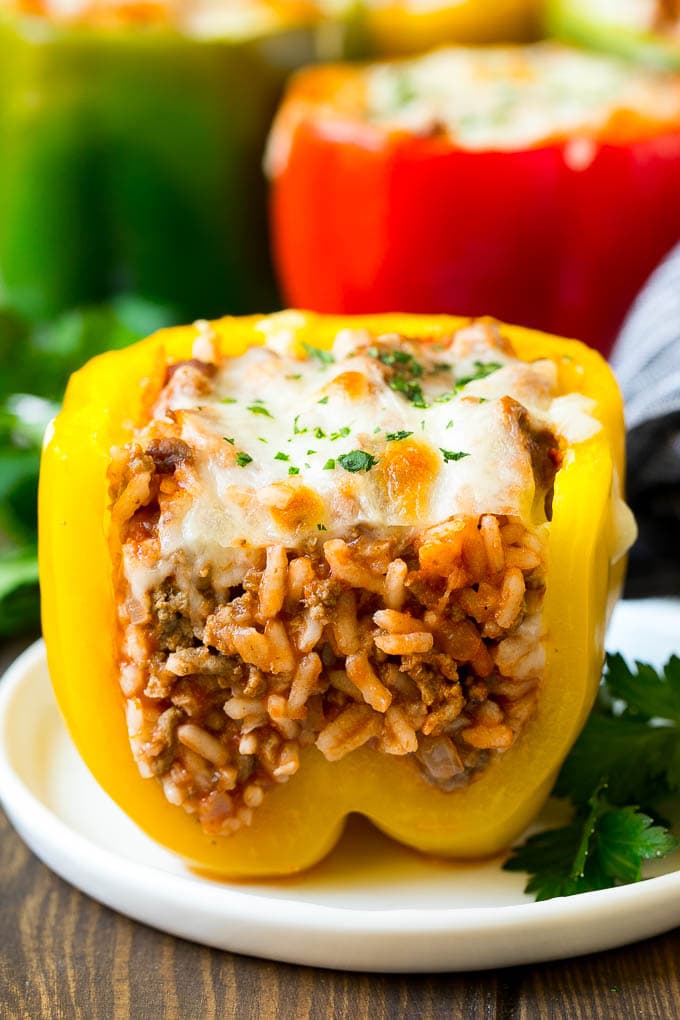 Stuffed Bell Peppers Recipe | Stuffed Peppers #beef #rice #peppers #dinner #cheese #bajap A stuffed bell pepper cut open on a plate.