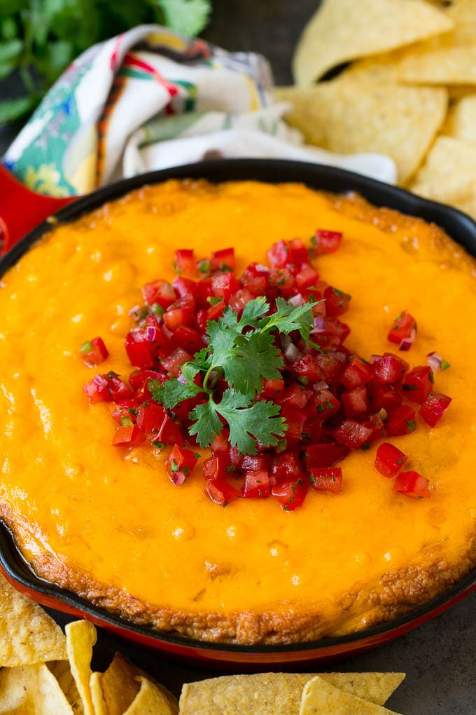 Bean Dip Recipe | Mexican Dip #dip #appetizer #mexicanfood #beans #cheese #bajap Cheesy Mexican bean dip topped with melted cheese and pico de gallo.