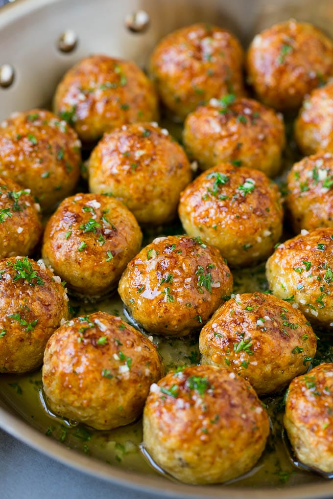 Chicken Meatballs Recipe | Baked Meatballs #chicken #meatballs #dinner #bajap #comfortfood Chicken meatballs in a skillet of garlic butter.